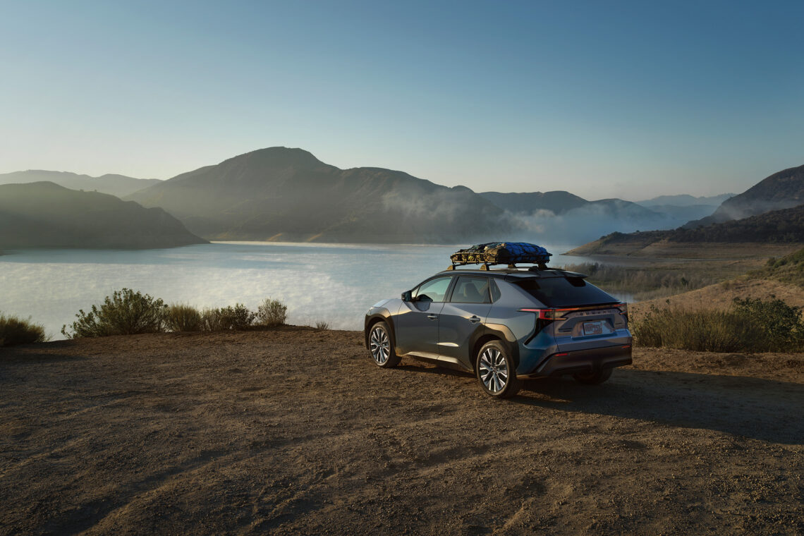 The 2027 Subaru Solterra parked near a lake