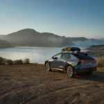 The 2027 Subaru Solterra parked near a lake