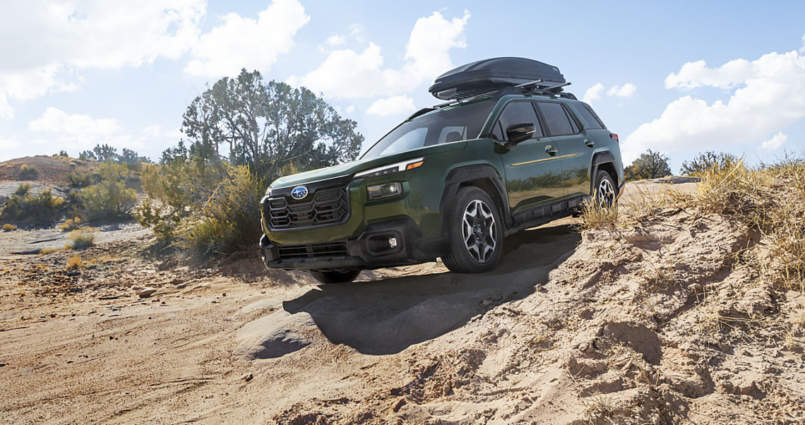 A new Subaru vehicle driving on rough terrain